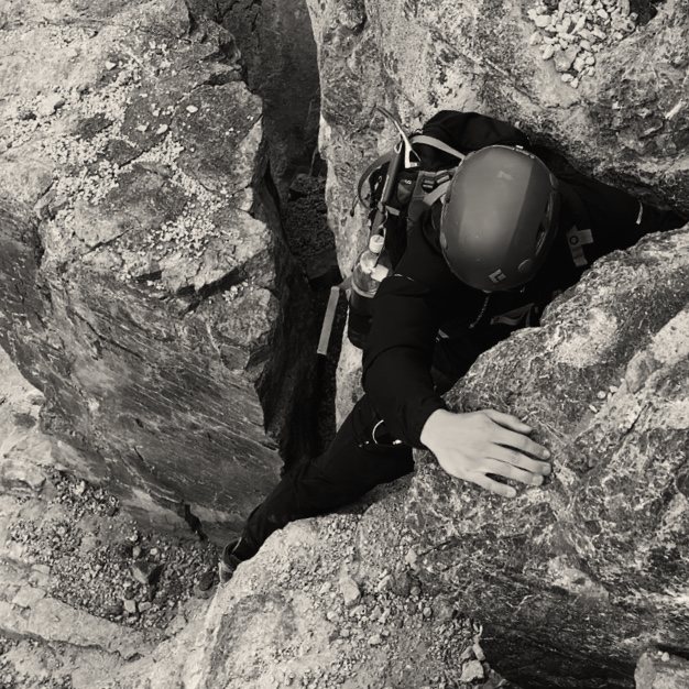 Matthew Link scrambling a rock chimney