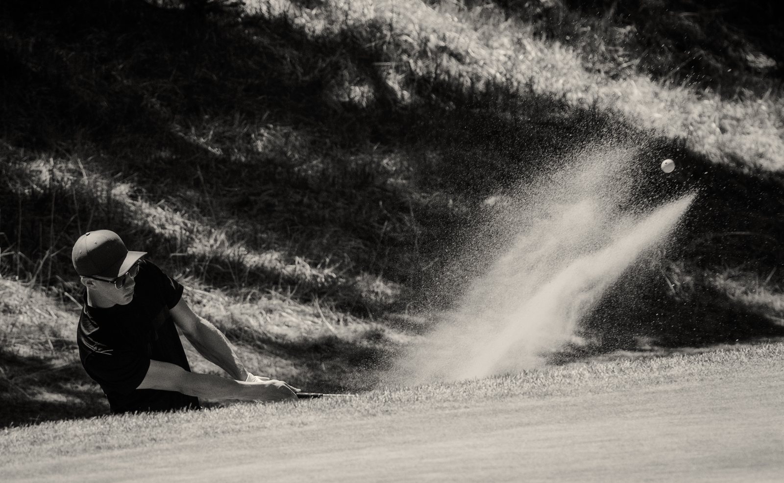 Matthew Link playing from a bunker as a PGA of Canada professional